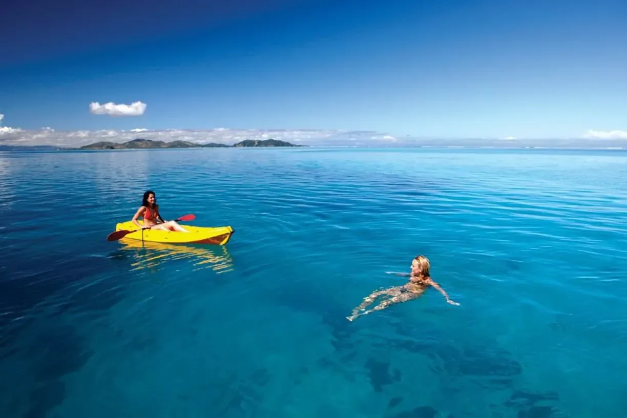 Kayaking and swimming in clear Fiji water